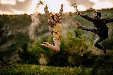 Full length of an elegant couple dancing together over sunset sky © qunica.com