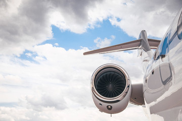 modern and comfortable business jet plane in the afternoon at the airport