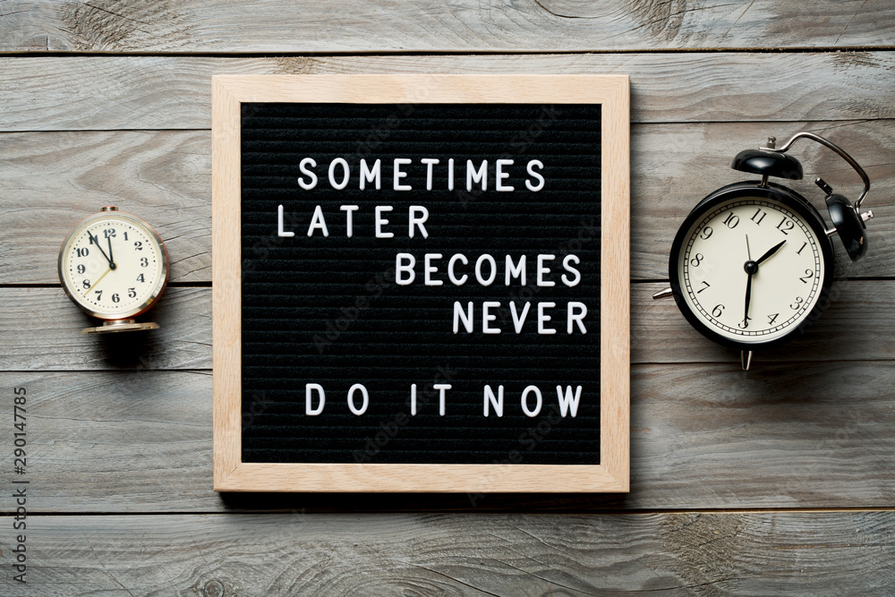 Wall mural inspirational motivational quote sometimes later becomes never. do it now words on a letter board on