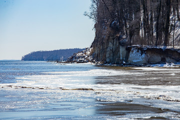 frozen view of the chesapeake bay cliffs along beach in calvert county maryland