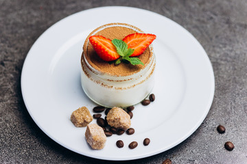 Panakota fresh cream dessert with strawberries and chocolate.