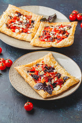 Tomato tarts with addition of aromatic herbs