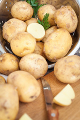 Raw potato. Fresh new potatoes on wooden background