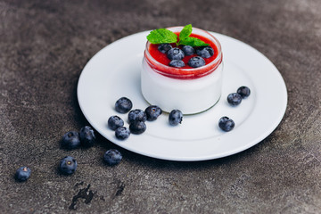 Panakota fresh cream dessert with blueberry on table.