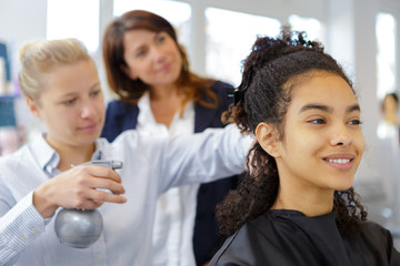doing a hairdo to client
