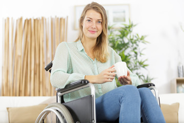 young woman in wheelchair indoors