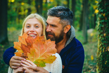 Pretty woman and handsome man walking in the Park and enjoying the beautiful autumn nature Outdoor Autumn atmospheric moments and dream.