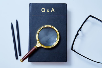 Analysis and analytic concept. Education, Q and A or question and answer concept. Magnifying glass...