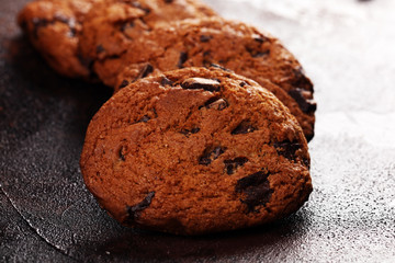 Chocolate cookies on wooden table. Chocolate chip cookies shot on table