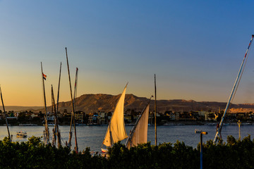 Traditional egyptian vessels feluccas on a Nile river in Luxor, Egypt