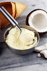 coconut ice cream scoop on a rustic table