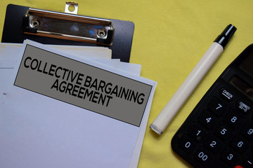 Collective Bargaining Agreement text on Document form isolated on office desk. 