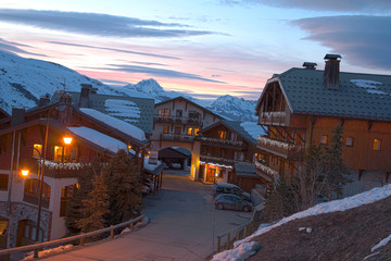 Panoramic view of ski resort three valleys and big lift in french alps - Vacation and travel concept - Winter high season opening with people having fun on mountain - Focus on sport equipment