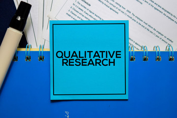Qualitative Research on sticky Notes isolated on Office Desk