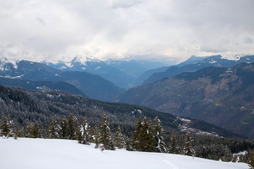 Panoramic view of ski resort three valleys and big lift in french alps - Vacation and travel concept - Winter high season opening with people having fun on mountain - Focus on sport equipment