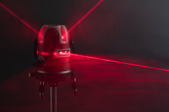 Laser Level Tool Red Light Beams In Smoke