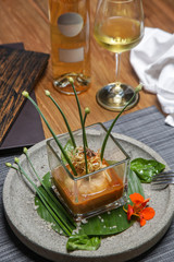 Prawn ballotine on lobster bisque. Exquisite dish. Creative restaurant meal. Fine dining concept.