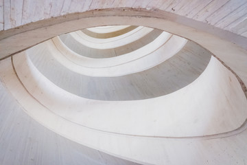 Fototapeta premium Circular concrete construction, abstract geometry background of light and bright tones.