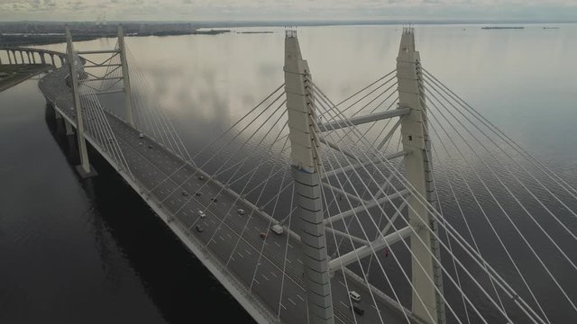 Aerial view fly above traffic on vant bridge. Fly over bridge