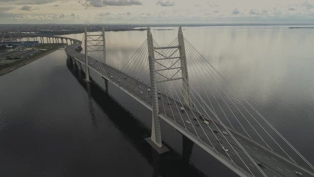 Aerial view traffic on cable stayed bridge at Saint-Petersburg. Fly above vant bridge.