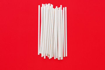paper straws on red background