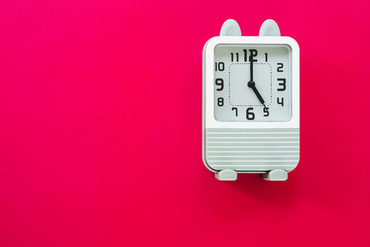 retro clock on red background