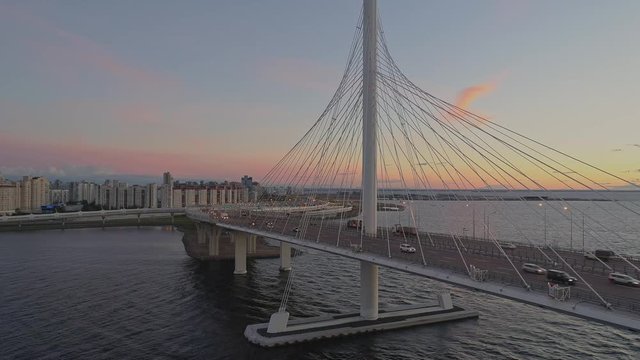 Saint-Petersburg, Russia - september 2018. Aerial view ZSD cable bridge in Saint-Petersburg after sunset. Traffic on road. Evening illumination
