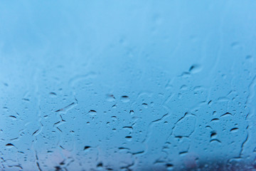 rain drops on the window at dusk