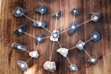 line connection of stone on wooden texture background. Business concept, Connection concept digital...