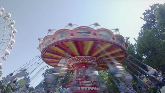 Merry-Go-Round. This stock video features a merry-go-round at the carnival as people enjoy the ride.