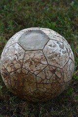 old soccer ball on grass