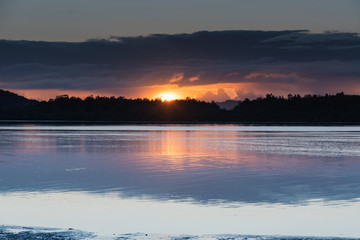 Fototapeta premium Sunrise Waterscape with Low Cloud Bank