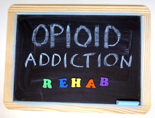 Fototapeta na wymiar Opioid addiction rehab message on chalkboard