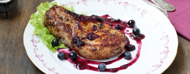 steak entrecote on pork bone with blueberry sauce. meat with berry sauce. delicious recipe.  berry sauce. 