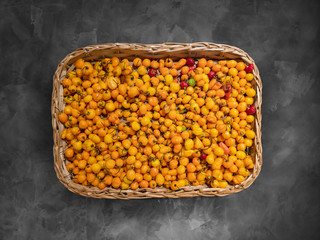 Basket with yellow mini peppers