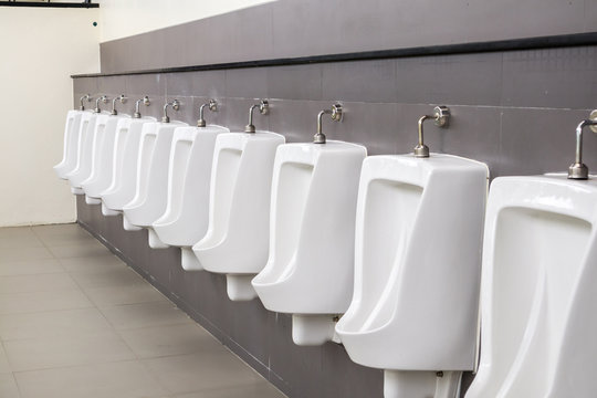White urinals in men toilet