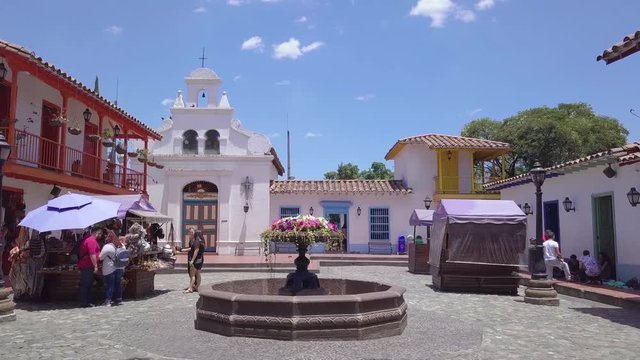 Slow revealing 4k shot showing church and plaza of Pueblo Paisa