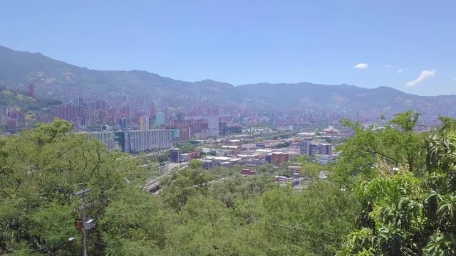 Beautiful sliding shot showing trees and hills of Medellin