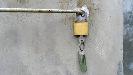 lock and key on cement background