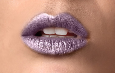 Fototapeta premium Beautiful woman with purple lips, closeup