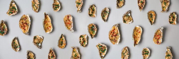 Tasty baked oysters on light background