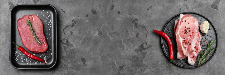 Tasty raw meat with spices on grunge background