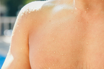 wet man. Drops trickle down my back. Happy man after hard physical work. the concept of strength exercises, weight loss, tanning, swimming