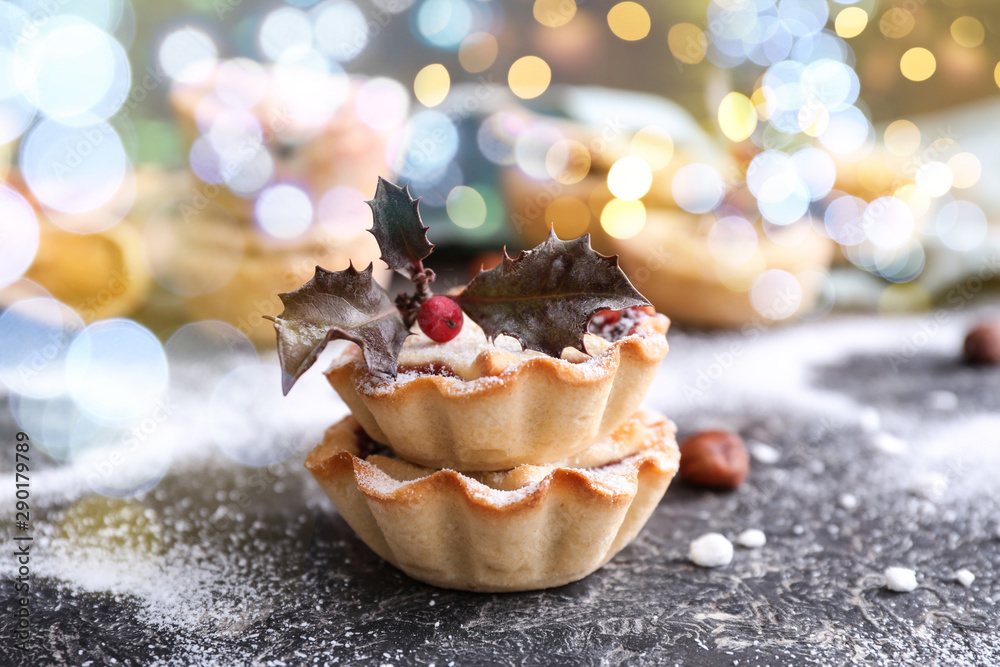 Wall mural Tasty mince pies on grunge table