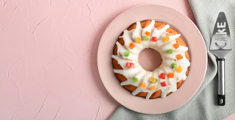 Plate with delicious Christmas cake on color table