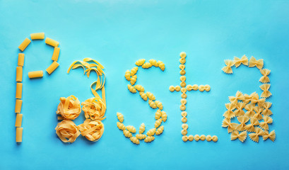 Obraz premium Flat lay composition with different uncooked pasta on color background