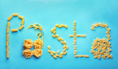 Flat lay composition with different uncooked pasta on color background