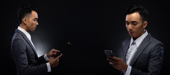 Group Pack Collage of Portrait 20s Asian Business Man under studio lighting dark background, Male in Proper Gray Suit hold digital tablet in hand and check social media, read e-mail report, iot
