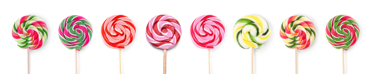 Different tasty lollipops on white background