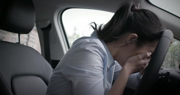 business woman feel failure in car